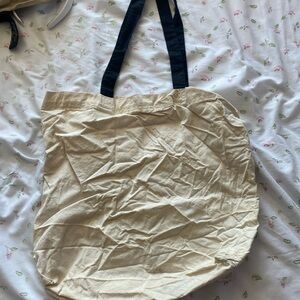 White tote bag with black straps